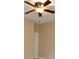 Bedroom with ceiling fan and an adjacent door at 10409 Meadow Crossing Dr, Tampa, FL 33647