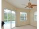 Gathering room with sliding doors leading to the pool at 10409 Meadow Crossing Dr, Tampa, FL 33647