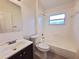 Clean bathroom with tub, toilet, and vanity at 462 Equine Dr, Tarpon Springs, FL 34688