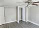 Bedroom with grey walls and double mirrored closet at 7832 Fox Den Row, Hudson, FL 34667