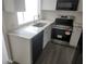 Updated kitchen with stainless steel appliances and quartz countertops at 7832 Fox Den Row, Hudson, FL 34667