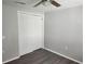 Bedroom with double-door closet and wood floor at 7832 Fox Den Row, Hudson, FL 34667