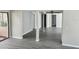 Open living room with grey vinyl flooring at 7832 Fox Den Row, Hudson, FL 34667