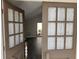 View through entry doors into living area at 7832 Fox Den Row, Hudson, FL 34667