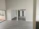 Bright and airy living area with neutral walls and vinyl flooring at 7832 Fox Den Row, Hudson, FL 34667