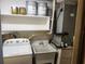 Laundry room with washer, dryer, and utility sink at 7832 Fox Den Row, Hudson, FL 34667