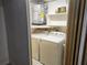 Laundry area with washer, dryer and water heater at 7832 Fox Den Row, Hudson, FL 34667