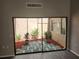 Private courtyard with decorative stone and mature plants at 7832 Fox Den Row, Hudson, FL 34667