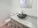 Updated bathroom with a vessel sink and gray vanity at 7832 Fox Den Row, Hudson, FL 34667