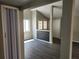 Open living area with gray walls and vinyl plank flooring at 7832 Fox Den Row, Hudson, FL 34667