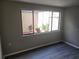 Bright bedroom with large window and neutral colored flooring at 7832 Fox Den Row, Hudson, FL 34667