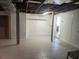 Unfinished basement with tiled floor at 7832 Fox Den Row, Hudson, FL 34667