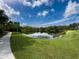 Peaceful lakefront view with a walking path at 3327 Golden Eagle Dr, Land O Lakes, FL 34639