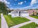 Single-story home with a two-car garage and neatly landscaped yard at 3327 Golden Eagle Dr, Land O Lakes, FL 34639