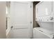 Bright laundry closet featuring a stacked washer and dryer set at 11437 Spectacled Dr, New Port Richey, FL 34654
