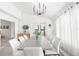 Bright dining room with a large table and access to the kitchen at 13521 Stacey Dr, Hudson, FL 34667