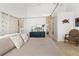 Main bedroom with a cozy sitting area and water views at 13521 Stacey Dr, Hudson, FL 34667