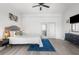 Main bedroom with a king-size bed and ensuite bathroom at 13521 Stacey Dr, Hudson, FL 34667