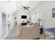 Living room with comfy sofa, TV, and access to other rooms at 13521 Stacey Dr, Hudson, FL 34667