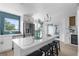 Gourmet kitchen featuring a large island, white cabinets, and blue tile backsplash at 13521 Stacey Dr, Hudson, FL 34667