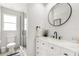 Clean bathroom with white vanity and black accents at 13521 Stacey Dr, Hudson, FL 34667