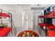 Bedroom with two bunk beds and access to spiral stairs at 13521 Stacey Dr, Hudson, FL 34667