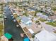 Aerial view of waterfront property with canal access and pool at 13521 Stacey Dr, Hudson, FL 34667