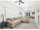 Spacious living room with two sofas and a view to dining area at 13521 Stacey Dr, Hudson, FL 34667