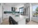 Modern kitchen boasting white cabinets, quartz countertops, and stainless steel appliances at 13521 Stacey Dr, Hudson, FL 34667