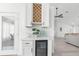 Stylish wet bar with wine rack and beverage cooler at 13521 Stacey Dr, Hudson, FL 34667