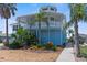 Two-story waterfront home with balcony and landscaped yard at 13521 Stacey Dr, Hudson, FL 34667