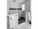 Spa-like shower with marble walls and a frameless glass enclosure at 13521 Stacey Dr, Hudson, FL 34667