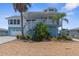Two-story home with attached garage, balcony, and landscaping at 13521 Stacey Dr, Hudson, FL 34667