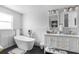 Modern bathroom with double vanity, soaking tub, and marble finishes at 13521 Stacey Dr, Hudson, FL 34667