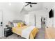 Bedroom with yellow bedding and a gray headboard at 13521 Stacey Dr, Hudson, FL 34667
