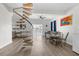 Bright dining area with spiral staircase, table, and chairs at 13521 Stacey Dr, Hudson, FL 34667