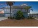 Charming waterfront home with a two-story design and stunning sunset views at 13521 Stacey Dr, Hudson, FL 34667