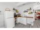 Small kitchen with white cabinets and wood countertops at 13521 Stacey Dr, Hudson, FL 34667