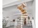 Unique spiral staircase leading to a lower level at 13521 Stacey Dr, Hudson, FL 34667