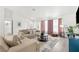 Spacious living area featuring neutral tones and ample natural light at 13521 Stacey Dr, Hudson, FL 34667