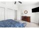 Bedroom with a dresser, large closet, and ceiling fan at 13521 Stacey Dr, Hudson, FL 34667