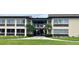 Condo building exterior with entrance and landscaping at 5123 Topaz Ln # 105, New Port Richey, FL 34652