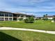 Community featuring well-manicured lawns and building exteriors at 5123 Topaz Ln # 105, New Port Richey, FL 34652