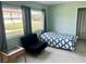 Bright bedroom with a comfortable chair and bed at 5123 Topaz Ln # 105, New Port Richey, FL 34652