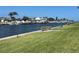 Scenic waterfront view with lush landscaping and boats at 5123 Topaz Ln # 105, New Port Richey, FL 34652