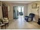 Spacious living room with tile floors and access to a sunroom at 5123 Topaz Ln # 105, New Port Richey, FL 34652