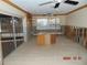 Kitchen with damaged walls and flooring at 2044 Montana Ne Ave, St Petersburg, FL 33703