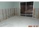 Room with exposed wall studs and damaged flooring at 2044 Montana Ne Ave, St Petersburg, FL 33703