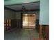 A dining room requiring complete renovation, showing damaged walls and floors at 2044 Montana Ne Ave, St Petersburg, FL 33703