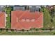 Aerial view of a condo building with a well-maintained roof and surrounding greenery at 6395 Banyan Blvd # 204, New Port Richey, FL 34652